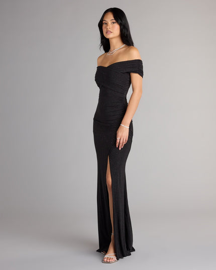 This prom dress, the Giada Glitter Knit Off-the-Shoulder Column Dress , features a sleek, floor-length design with trend-forward details that capture the excitement of Prom 2026.