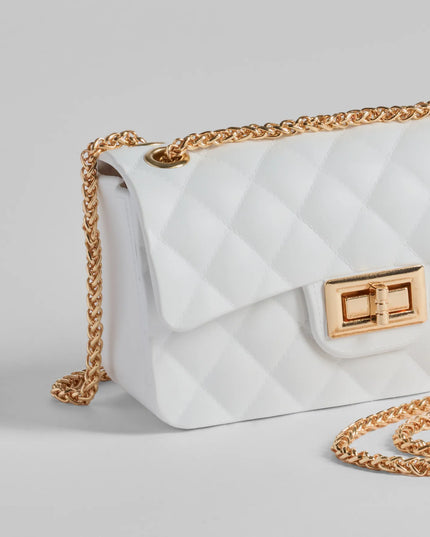 
Upgrade your style game for 2025 with the Trendsetter Quilted Diamond Small Crossbody in white, perfect for any fashion-forward wardrobe.